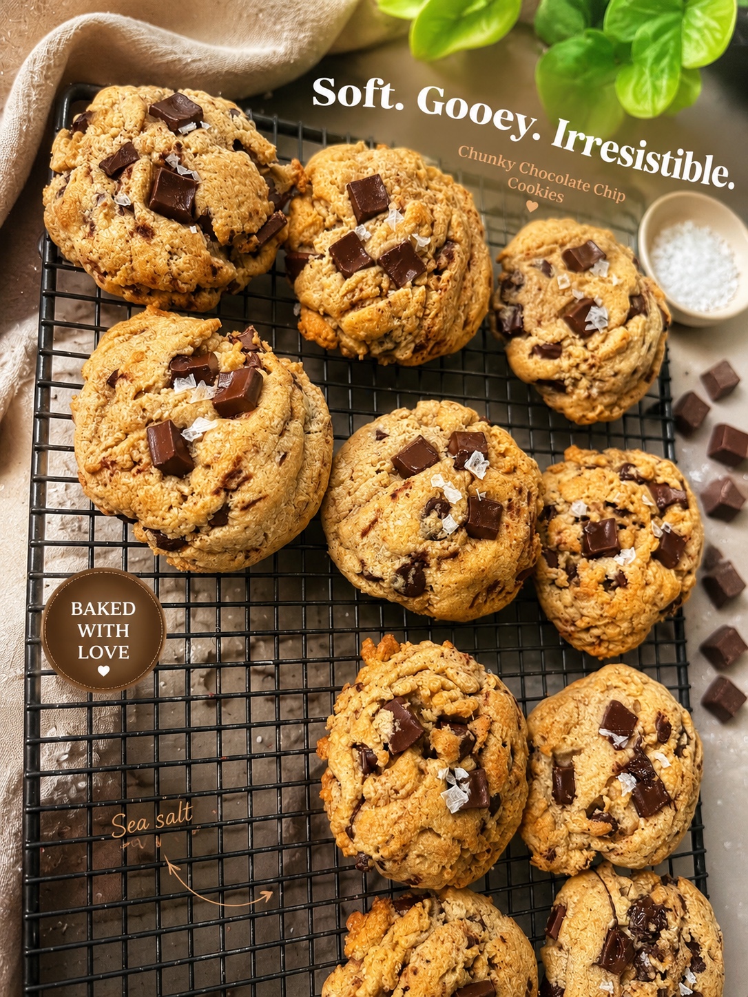 Brown butter chocolate chunk cookies cooling on a rack with flaky sea salt