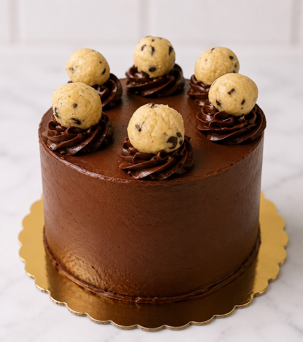 Chocolate cake topped with cookie dough truffles